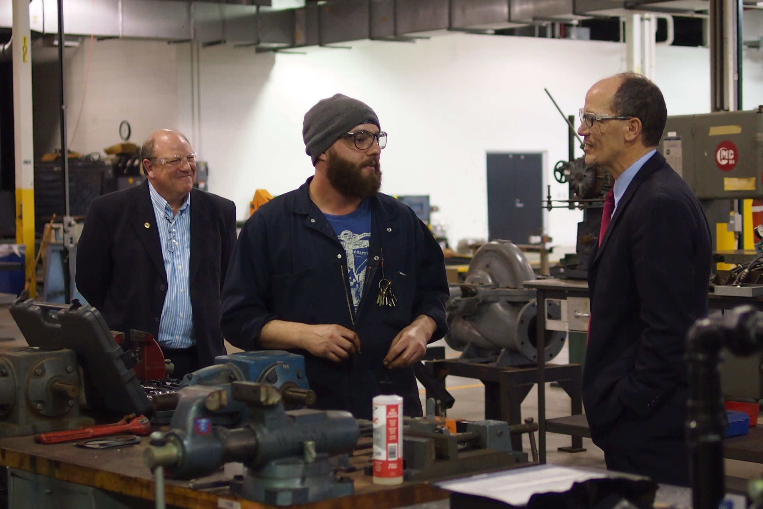 US Secretary of Labor Tom Perez chats with Joe Joerin, an apprentice at the UAW-Ford Technical Training Center. Mechanical engineering jobs are one of the occupations for which foreign workers can obtain H-1B visas. H-1B-eligible occupations are also a focus of the H-1B Ready to Work Partnership Grants, with the intent of enabling long-term unemployed American workers to fill these positions. (Photo: US Department of Labor)